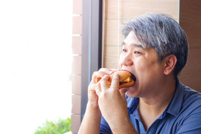 Portrait of man eating food