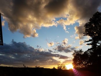 Low angle view of silhouette trees against sky during sunset