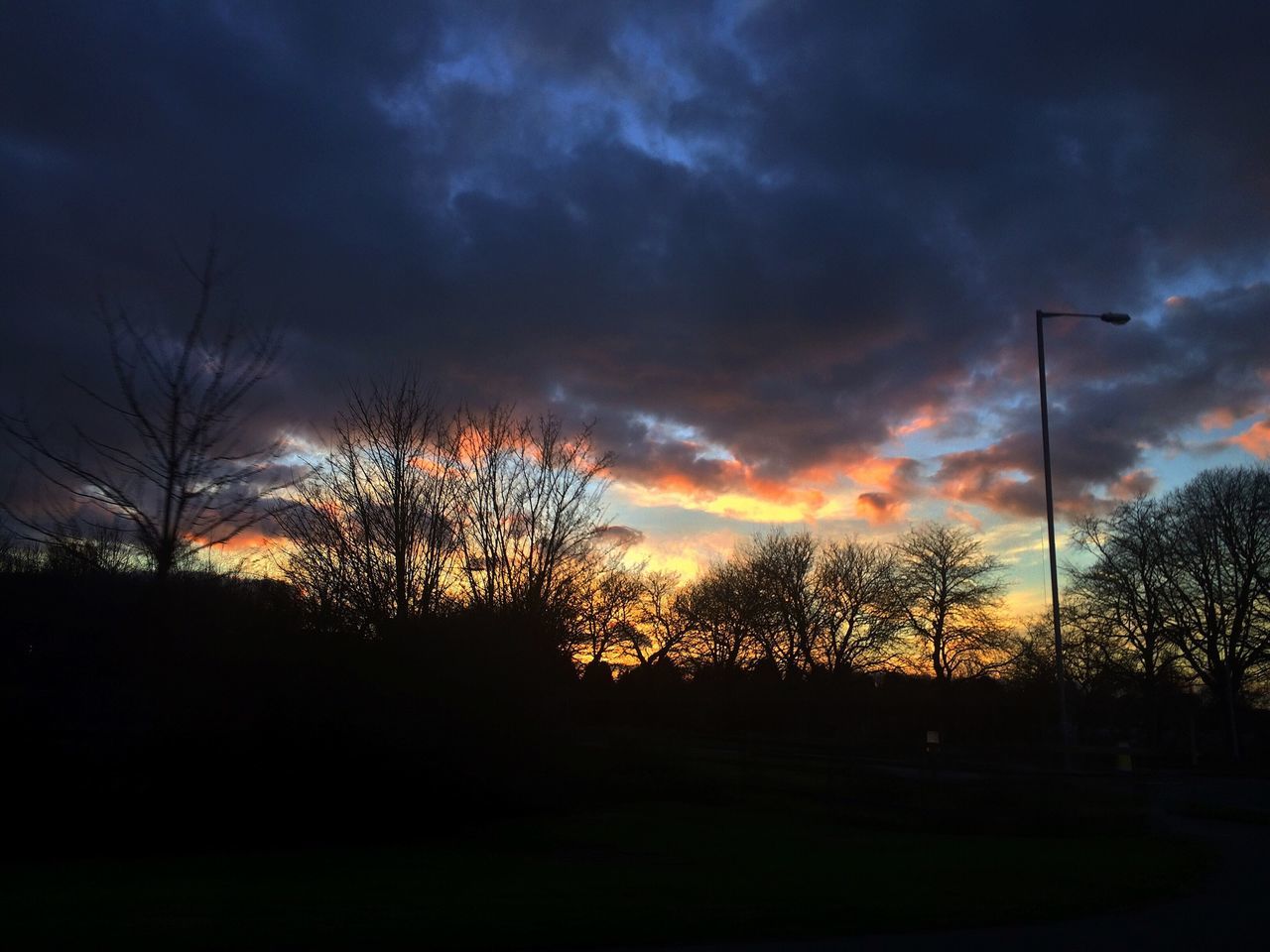 silhouette, sunset, sky, tree, cloud - sky, tranquility, tranquil scene, beauty in nature, scenics, cloudy, nature, dramatic sky, landscape, dark, cloud, idyllic, dusk, bare tree, orange color, low angle view