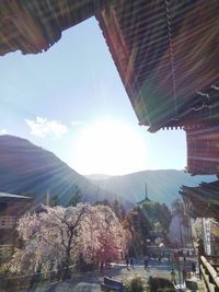 Panoramic view of buildings and mountains against sky