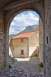 An entrance arch in the medieval village of sperlonga, in the lazio region, italy.