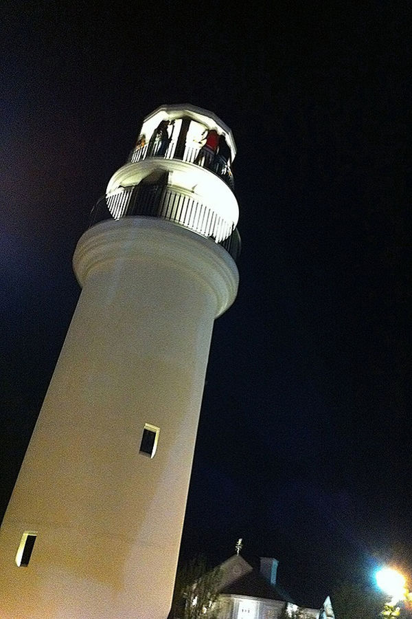 low angle view, building exterior, architecture, built structure, tower, night, illuminated, lighting equipment, sky, tall - high, lighthouse, street light, modern, city, technology, outdoors, no people, copy space, industry, guidance