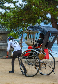 Rear view of man with bicycle