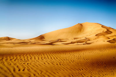 Scenic view of desert against clear sky