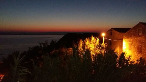 Scenic view of calm sea at sunset