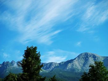 Scenic view of mountains against cloudy sky