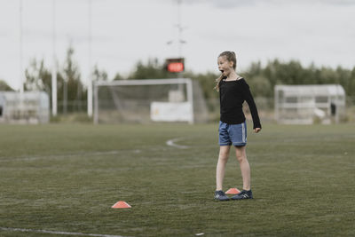 Girl on football pitch