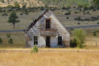 Abandoned building on field