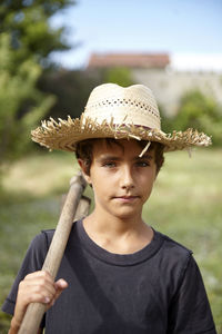 Portrait of a farmer kid in a field. nice childhood.
