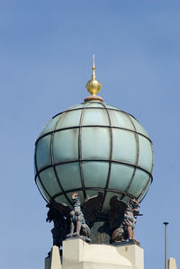 Low angle view of statue of liberty against blue sky