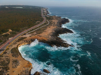Aerial view of rocky coastline with a road