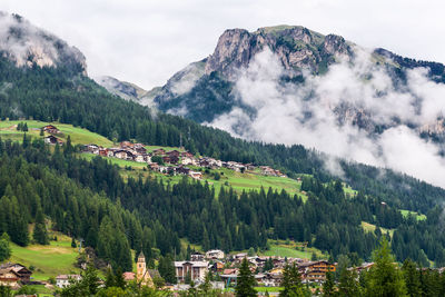 Scenic view of mountains against cloudy sky