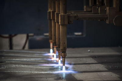 Tool cutting metal at factory