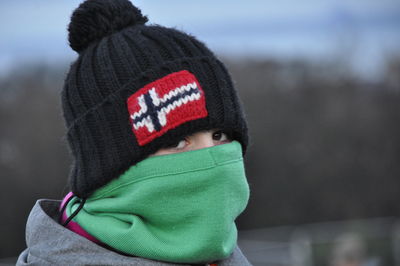Close-up portrait of boy wearing hat during winter