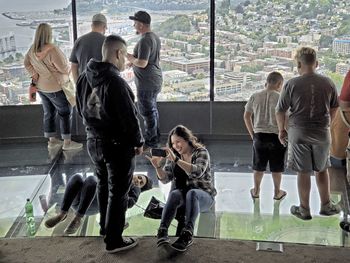 Rear view of people standing outdoors