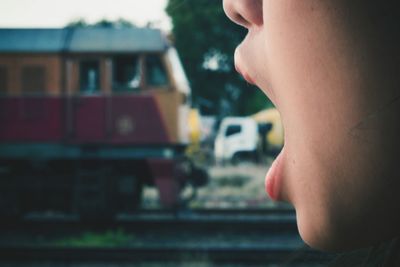 Optical illusion of woman eating train