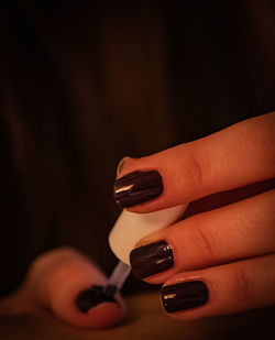 Close-up of woman hand holding text