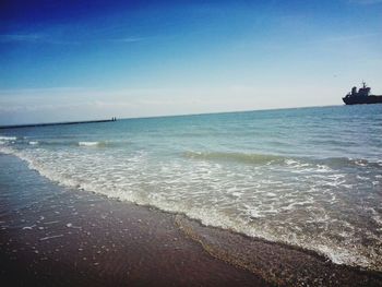 Scenic view of beach against clear sky