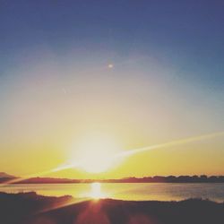 Sun shining over sea