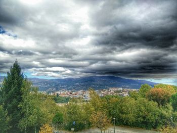 Scenic view of landscape against cloudy sky
