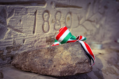Close-up of flag against wall