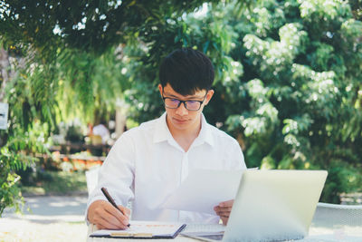 Portrait of young man using smart phone