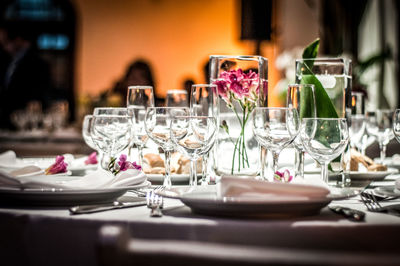 Empty by wineglasses on table in restaurant