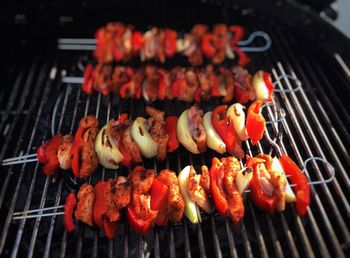 High angle view of meat on barbecue grill