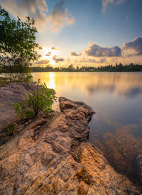 Scenic view of lake against sky during sunset