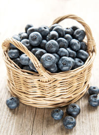 Freshly picked blueberries on a old wooden background. concept for healthy eating