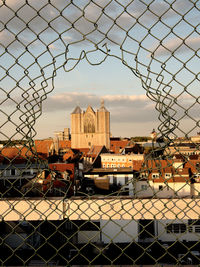 View over city with fence in foreground