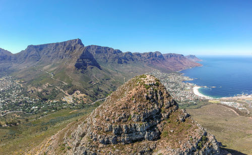 Drone view of the summit of lion's head mountain and table mountain in cape town, south africa.