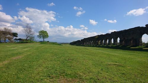 Roman aqueduct remnants on grasslands