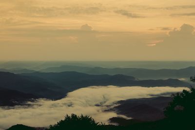 Scenic view of mountains against sky during sunset