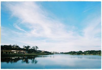 Scenic view of calm lake against sky