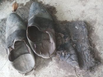 High angle view of shoes on rock