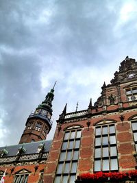 Low angle view of building against cloudy sky