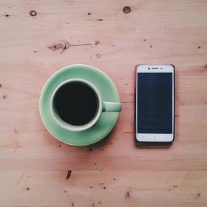 Directly above shot of coffee cup on table