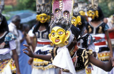 People wearing masks during traditional festival