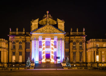 Low angle view of illuminated building at night