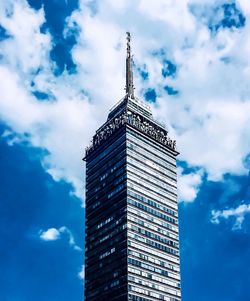 Low angle view of building against cloudy sky