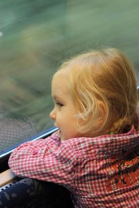 Close-up of girl traveling in train