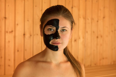 Portrait of beautiful woman with facial mask on face