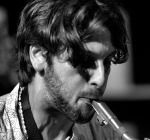 Close-up portrait of young man smoking cigarette