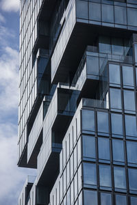 Low angle view of modern buildings against sky