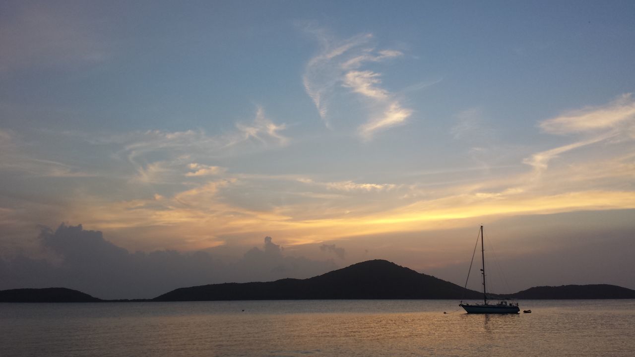 water, mountain, sunset, sea, scenics, sky, tranquil scene, waterfront, beauty in nature, tranquility, nautical vessel, mountain range, boat, transportation, nature, cloud - sky, idyllic, silhouette, mode of transport, cloud