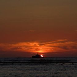 Scenic view of sea at sunset