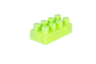 Green toy over white background