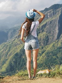 Rear view of woman looking at mountains