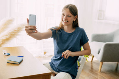 Young woman using mobile phone